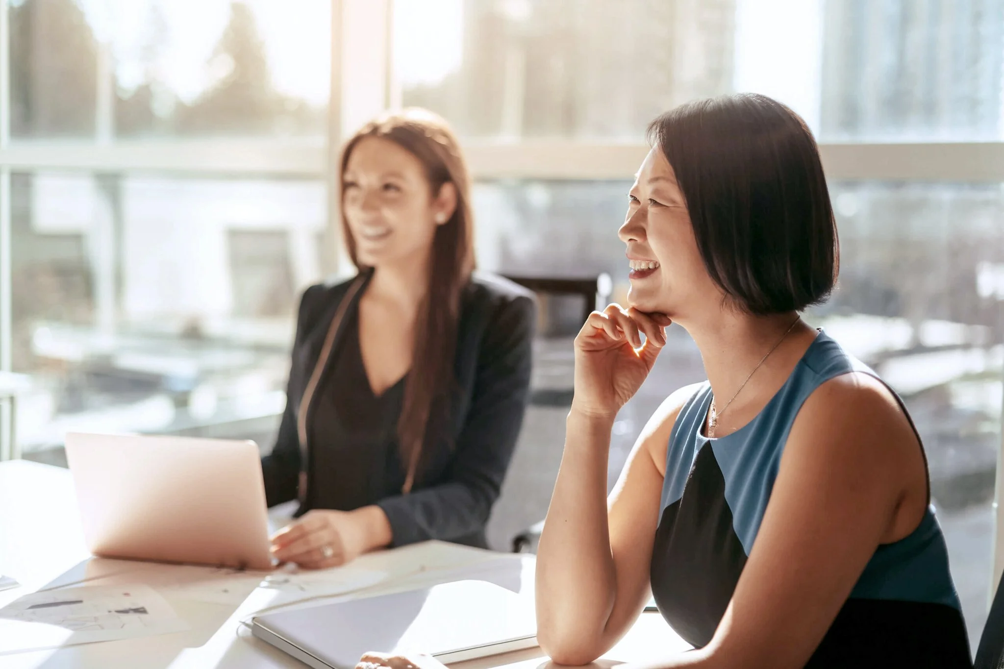 Business leaders working together in a bright office